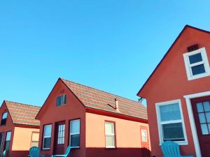 Orange houses under clear blue sky.